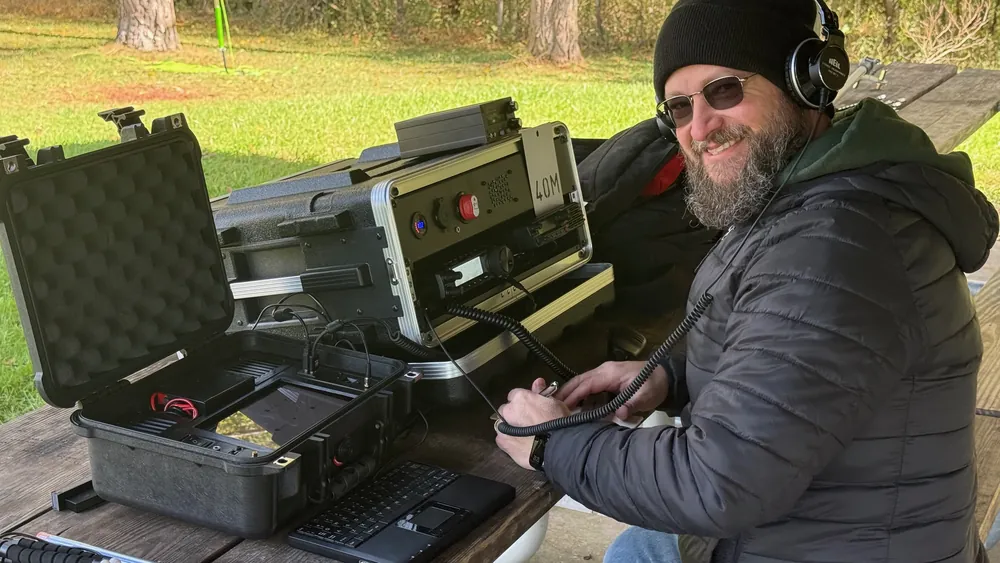 A smiling operator at a portable go-box station